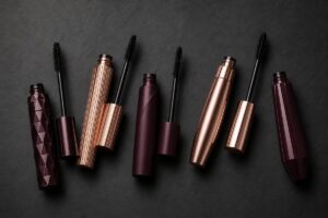 5 luxury mascara tubes on dark charcoal background, Best Mascaras on Amazon UK